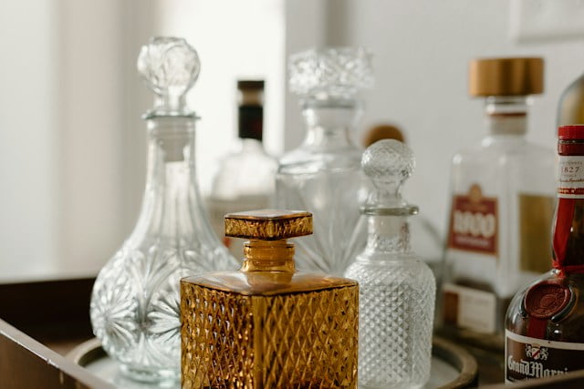 Vintage style bar cart with various glass decanters