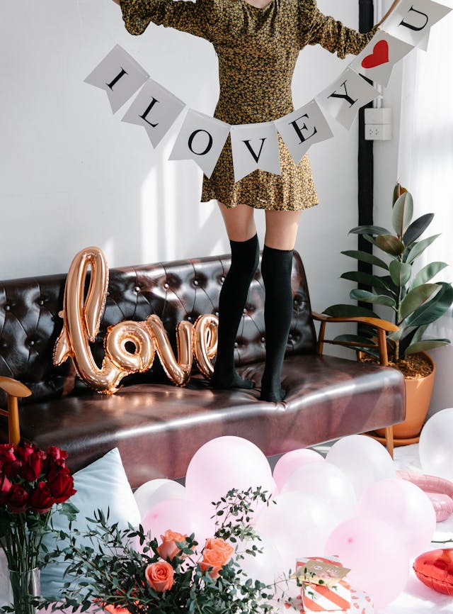 woman holding valentine's day decorative banner