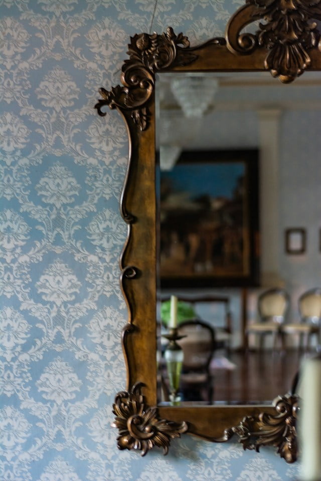 Blue and white pastel wallpaper with large mirror