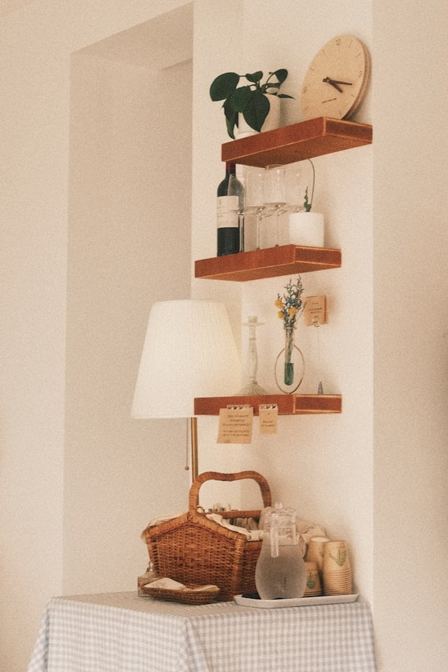 Coffee bar decor ideas with vertical hanging wooden shelves and plants