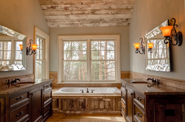 western bathroom with wooden walls