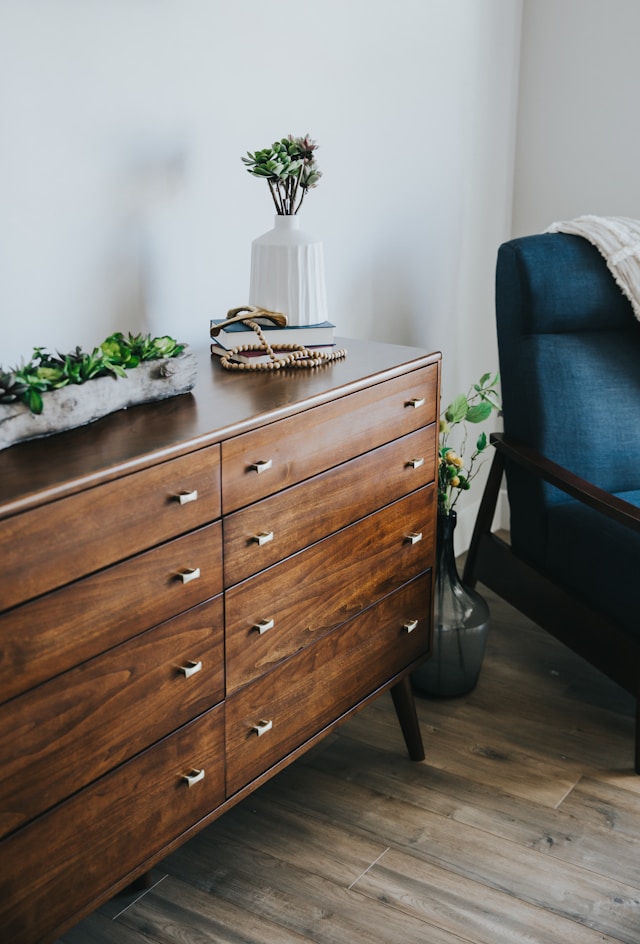 brown bedroom dresser with gold square hardware