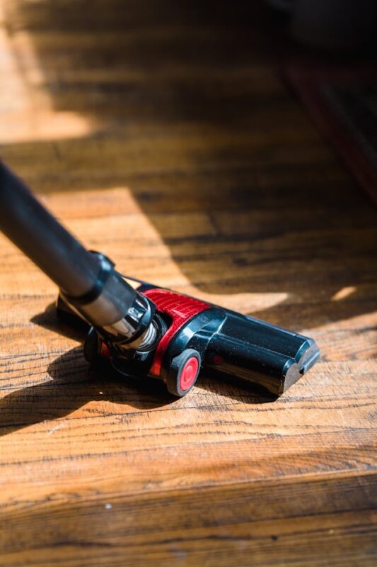 clean your messy house by vacuuming your hardwood floors