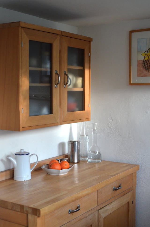 oak cabinets look modern with frosted glass inserts