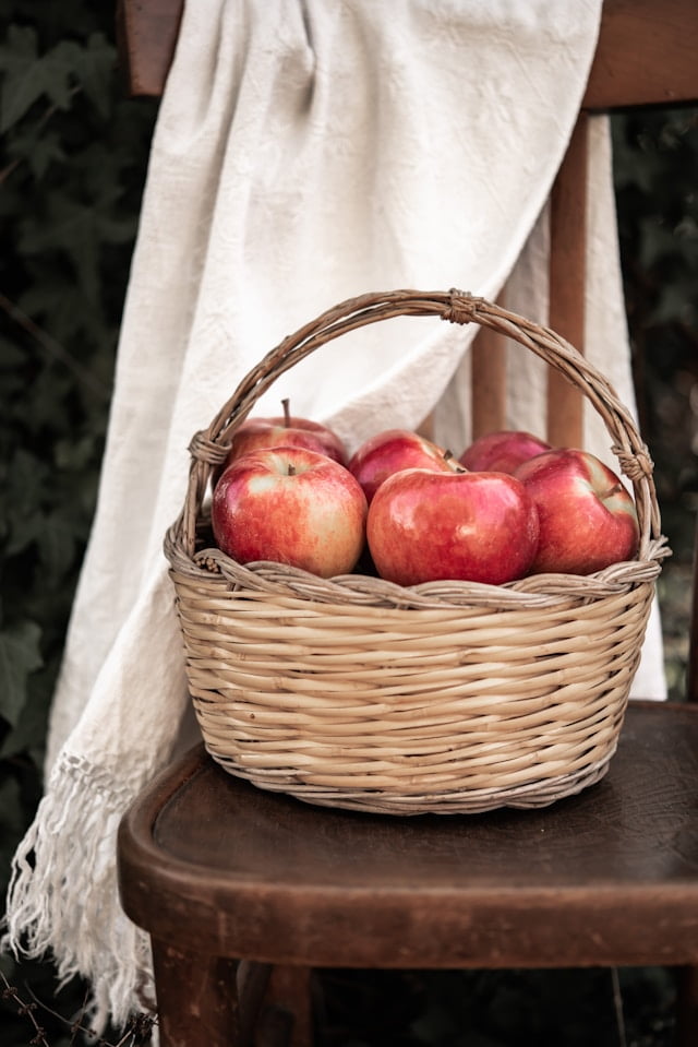 woven fruit basket with red apples