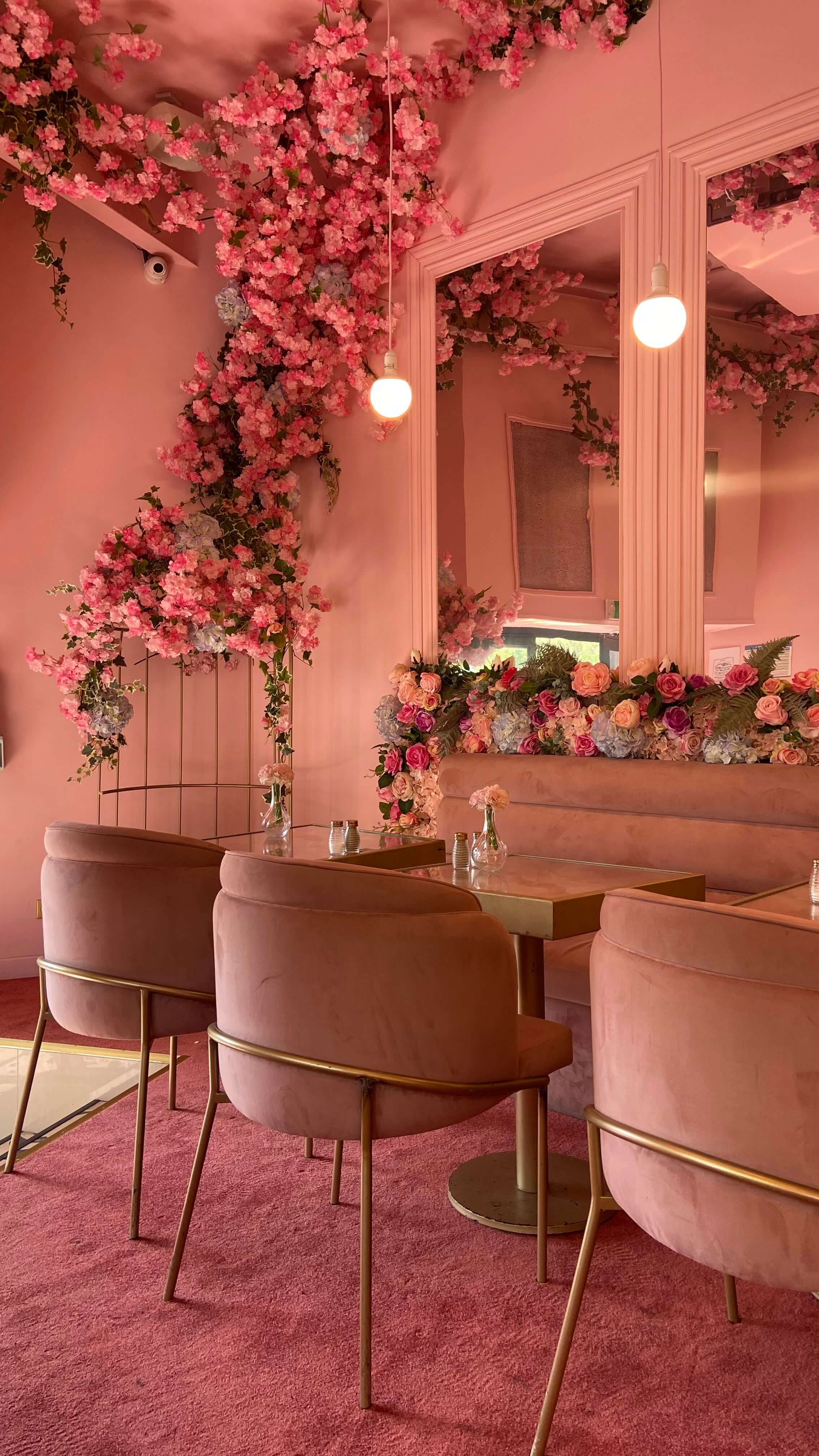 bright pink maximalist decor with pink flowers 