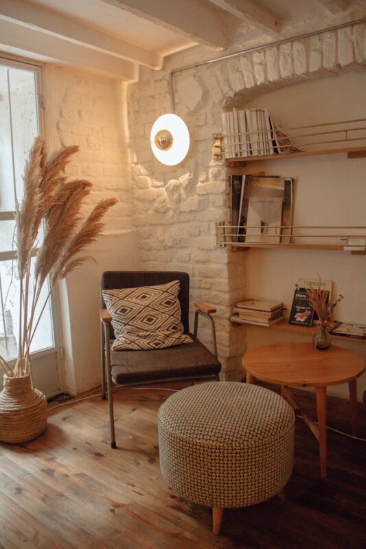 modern boho room with warm lighting and magazines