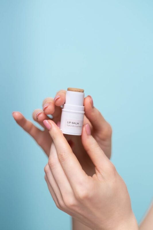 hands holding natural lip balm